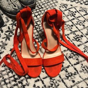 Lightly worn red strap up heals